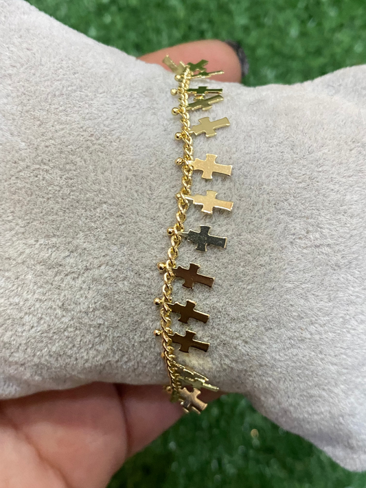 Pulsera dorada de cruces con baño en oro