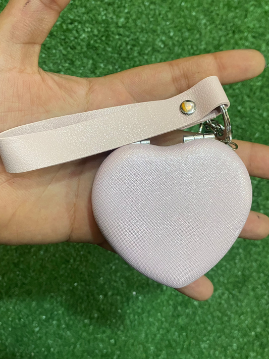 Espejo de mano en forma de corazón brillante