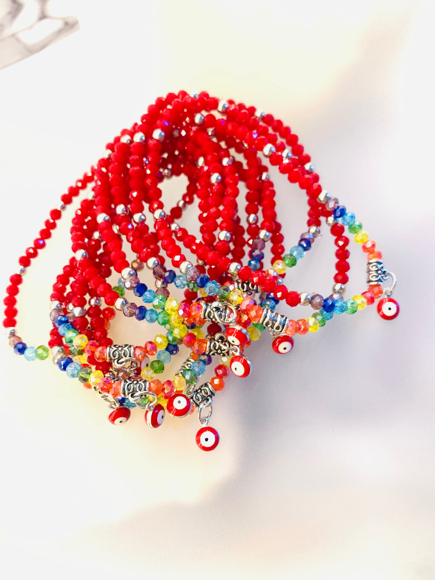 🔮 Pack Pulseras 7 Chakras + Ojo Turco Rojo | Protección Energética en Cristal Facetado 4mm (12 unidades)