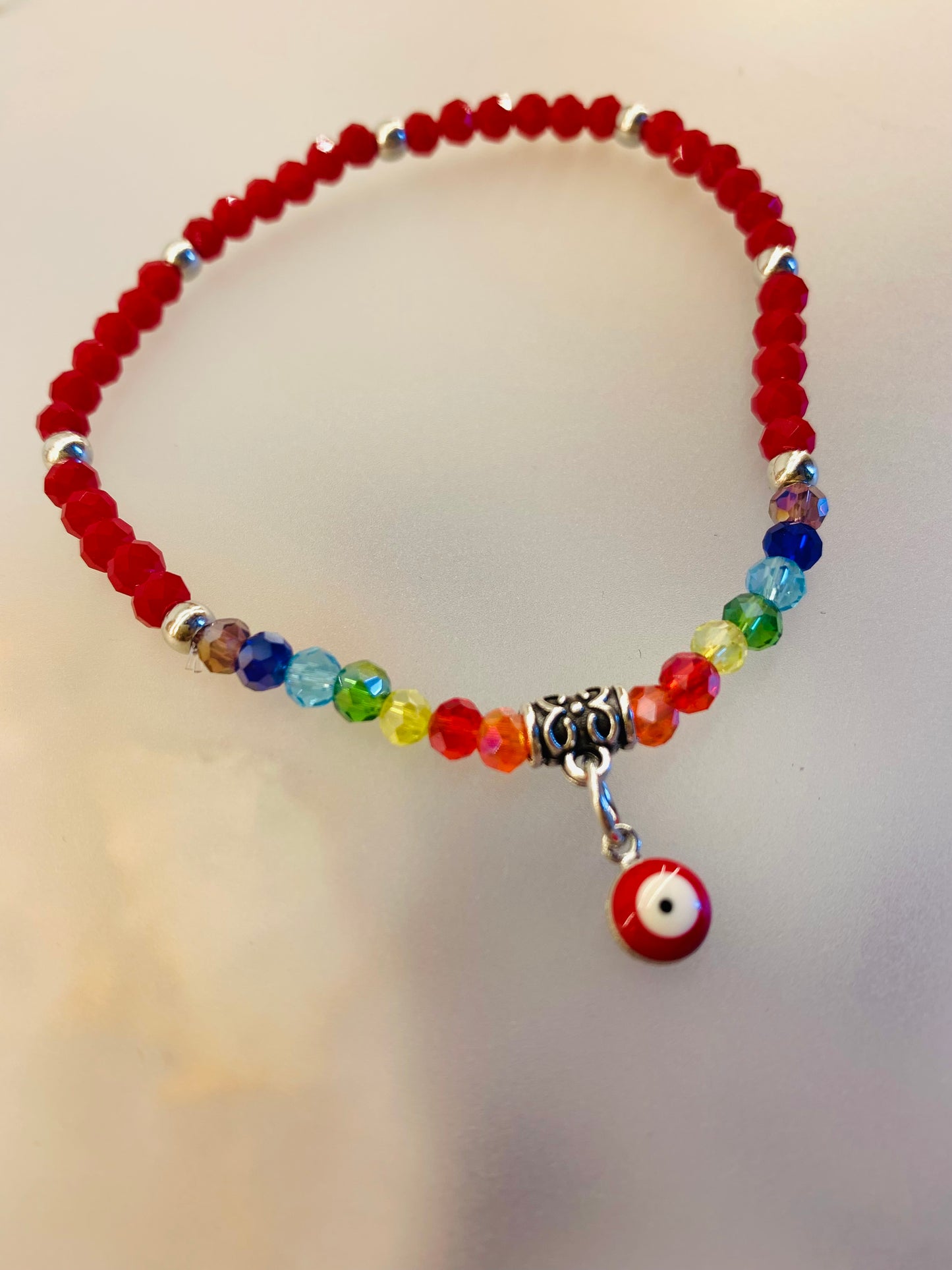 🔮 Pack Pulseras 7 Chakras + Ojo Turco Rojo | Protección Energética en Cristal Facetado 4mm (12 unidades)
