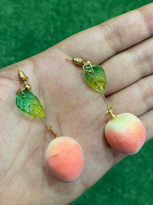 Aros de durazno aterciopelados en material fantasía