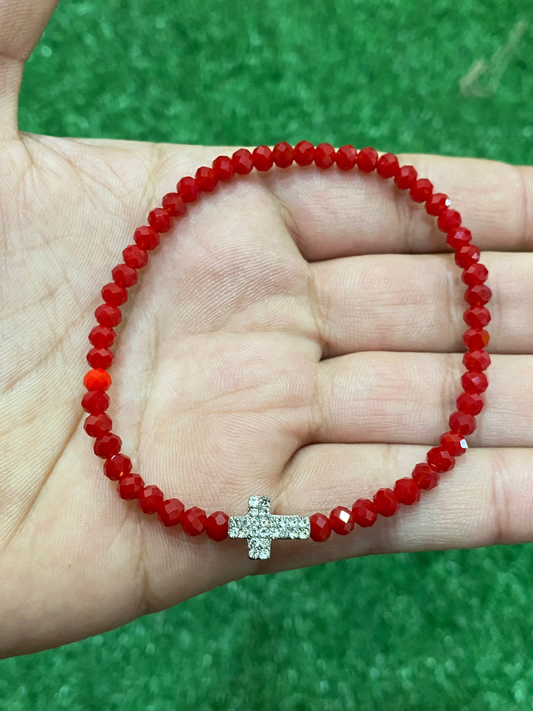 Pack de 3 pulseras rojas elásticas con dije de cruz