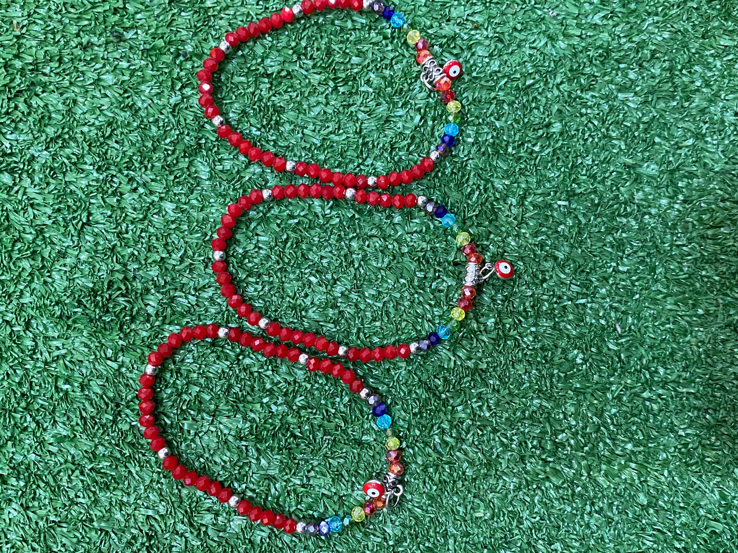 Pack de pulseras rojas elásticas con los 7 chakras y ojo turco